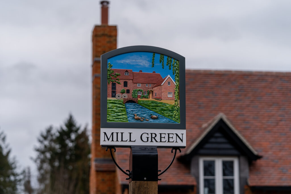 Mill Green Village shortlisted in the Royal Institution of Chartered Surveyors Awards village sign