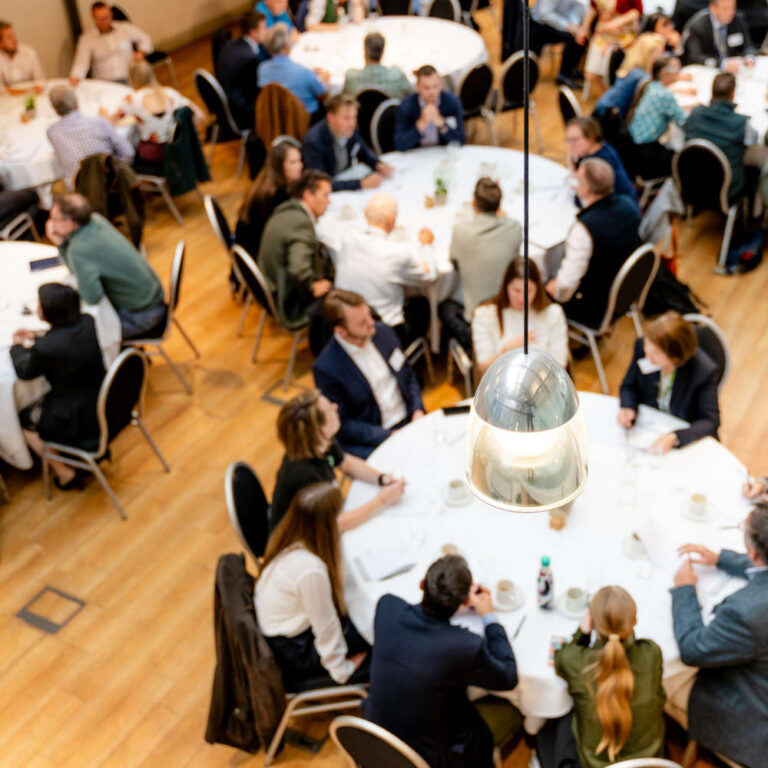 conference planning checklist event attendees at tables
