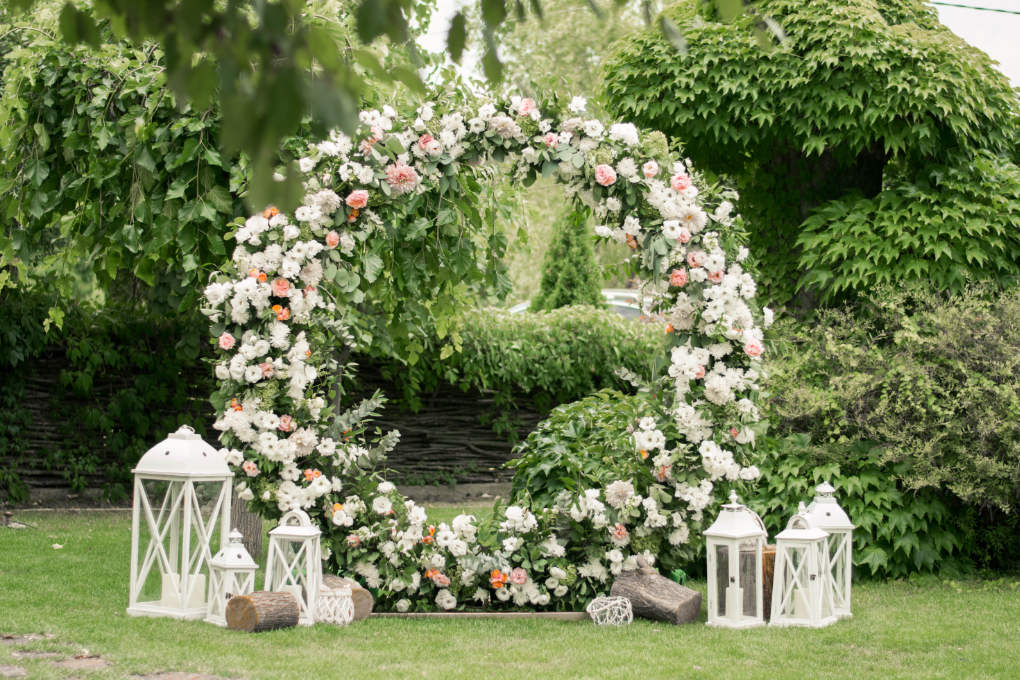 wedding ceremony arch ideas - a round flowered structure
