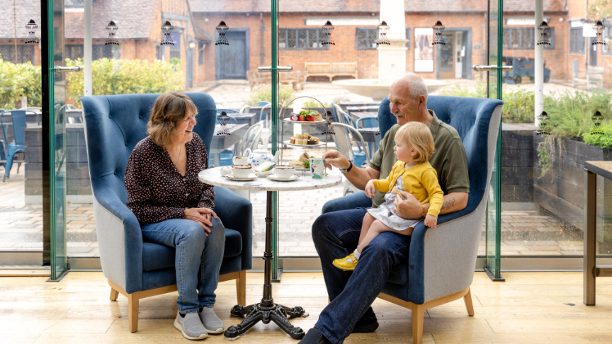 Coach House Kitchen - a family with a toddler enjoying afternoon tea